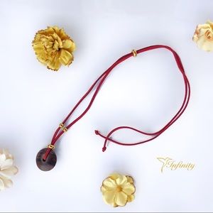 Handmade necklace with wooden pendant